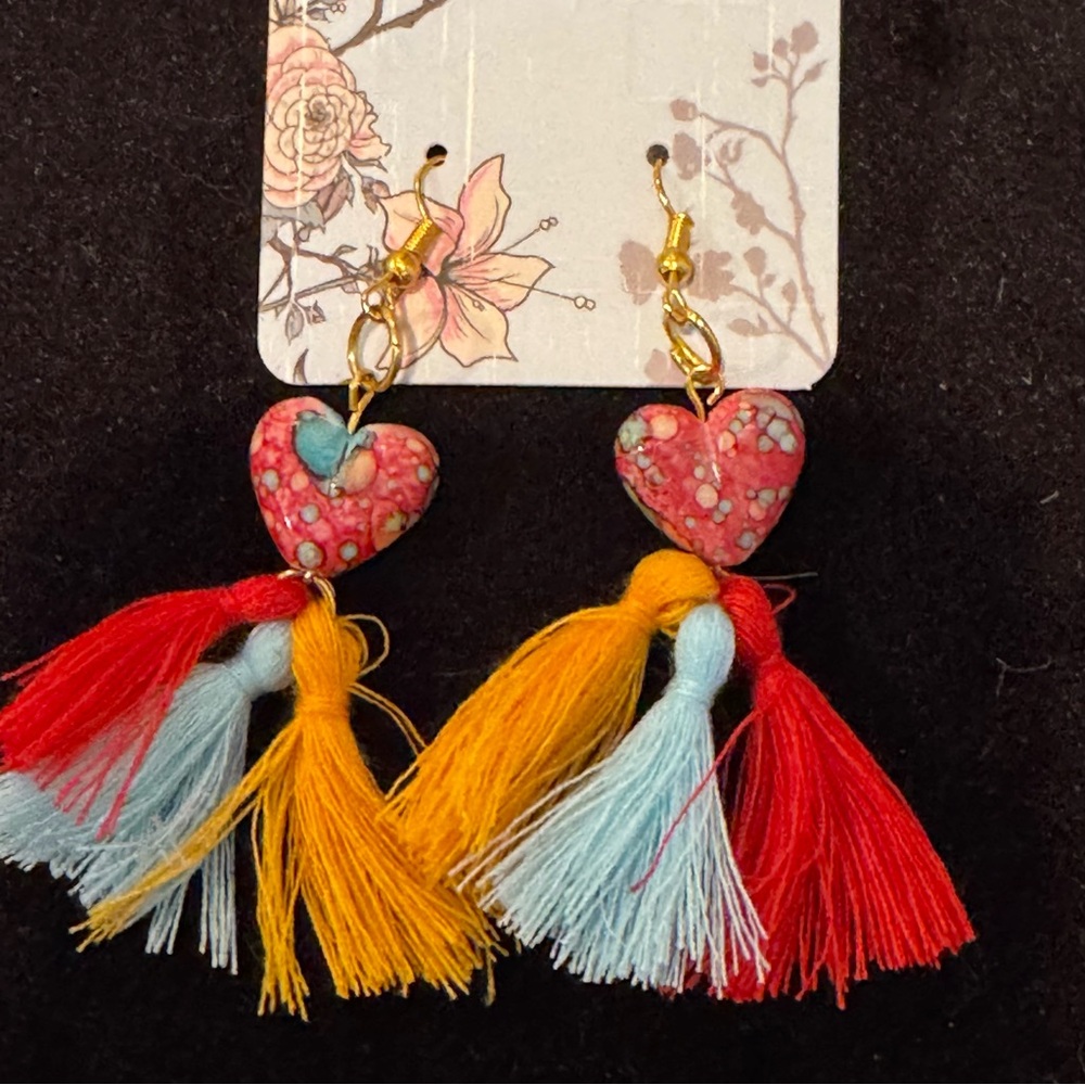Handmade earrings made from glass and thread. Unique and beautiful pieces